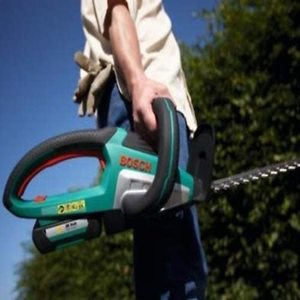 Carrying the Bosch AdvancedHedgeCut 36 Cordless Hedge Cutter.