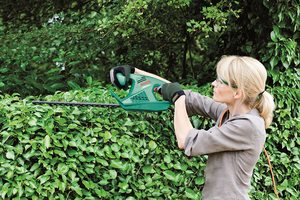 Bosch AHS 45-16 Hedge Trimmer in use.
