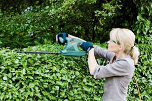 Bosch AHS 60-16 Hedge Trimmer in use.