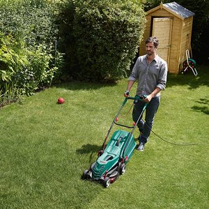 Bosch Rotak 36R Electric Rotary Lawnmower in use.