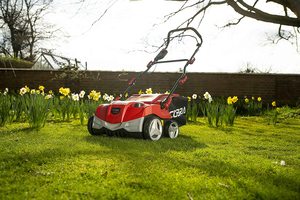 Cobra S3840V Cordless Lawn Scarifier in a garden.