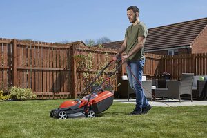 Flymo Chevron 32VC Electric Wheeled Lawnmower in use.