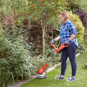 Flymo Contour Cordless 20V Li Grass Trimmer in use.