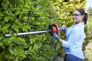 Flymo EasiCut 610XT Hedge Trimmer in use.