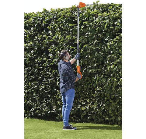 Flymo SabreCut XT Cordless Hedge Trimmer in use.