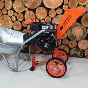 Forest Master FM6DD Petrol Wood Chipper ejecting chippings into a wheelbarrow.