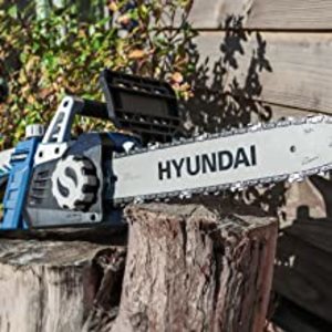 Hyundai HYC1600E Electric Chainsaw in a garden.