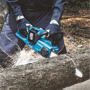 Makita DUC353Z Cordless Chainsaw in use.