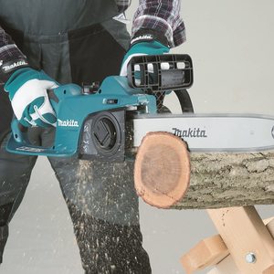 Makita UC3541A 2 Electric Chainsaw in use.