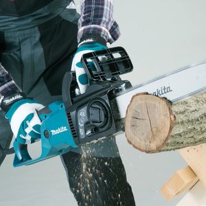 Makita UC3551A/2 Electric Chainsaw in use.