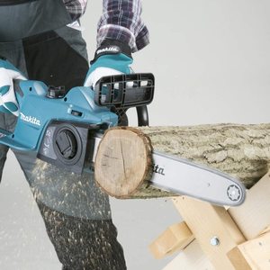 Makita UC4041A/2 Electric Chainsaw in use.