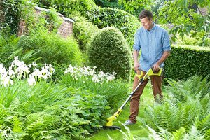 Ryobi OLT1832 ONE+ Cordless Grass Trimmer in use.