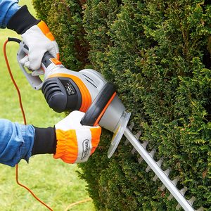VonHaus 710W Rotatable Hedge Trimmer in use.