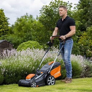 Yard Force 40V 34cm Cordless Lawnmower in use.