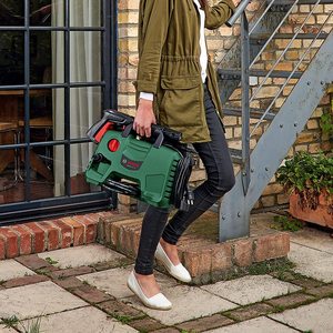 Bosch EasyAquatak 110 Pressure Washer being carried.