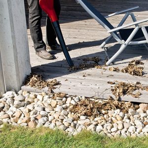 Einhell Cordless Leaf Blower in use.