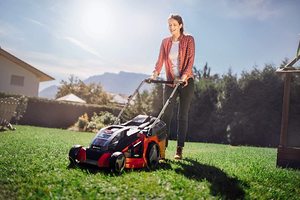 Einhell GE-CM 43 Li M Cordless Lawn Mower in use.