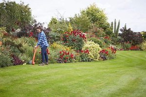 Cutting edges with the Flymo Contour XT Electric Grass Trimmer.