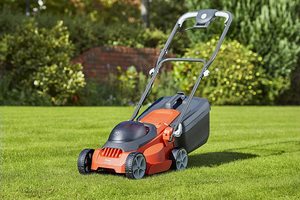 Flymo EasiStore 300R Li Cordless Rotary Lawn Mower in a garden.