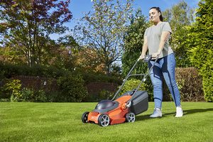 Flymo EasiStore 300R Li Cordless Rotary Lawn Mower in use.