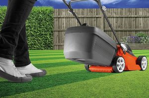 Flymo EasiStore 340R Li Cordless Rotary Lawn Mower in use.