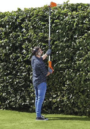 Flymo SabreCut XT Corded Hedge Trimmer in use.