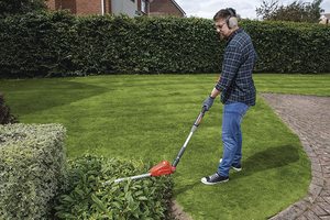 Flymo SabreCut XT Cordless Hedge Trimmer in use.