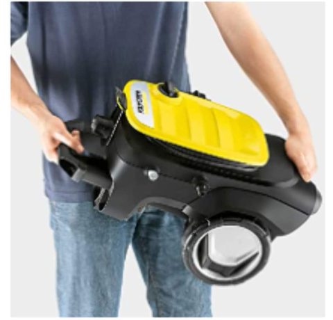 Carrying the Karcher K7 Compact Pressure Washer.