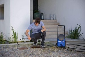 Nilfisk Core 130 Pressure Washer in use.