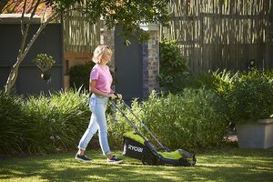 Ryobi OLM1833B Lawn Mower in use.