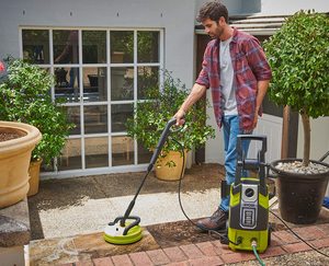 Ryobi RPW130XRBB Pressure Washer in use.