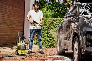 Ryobi RPW130XRBB Pressure Washer in use.