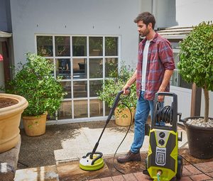 Ryobi RPW150XRB Pressure Washer in use.