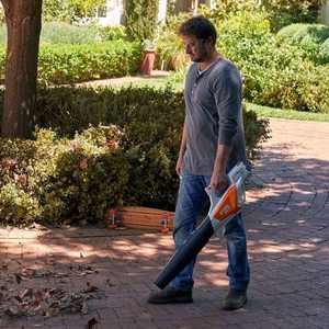Stihl BGA 57 Cordless Leaf Blower in use.