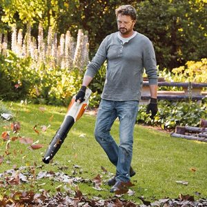 Stihl BGA 57 Cordless Leaf Blower in use.