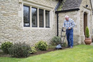 The Handy Electric Garden Tiller in use.