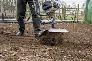 The Handy Petrol Mini Tiller in use.